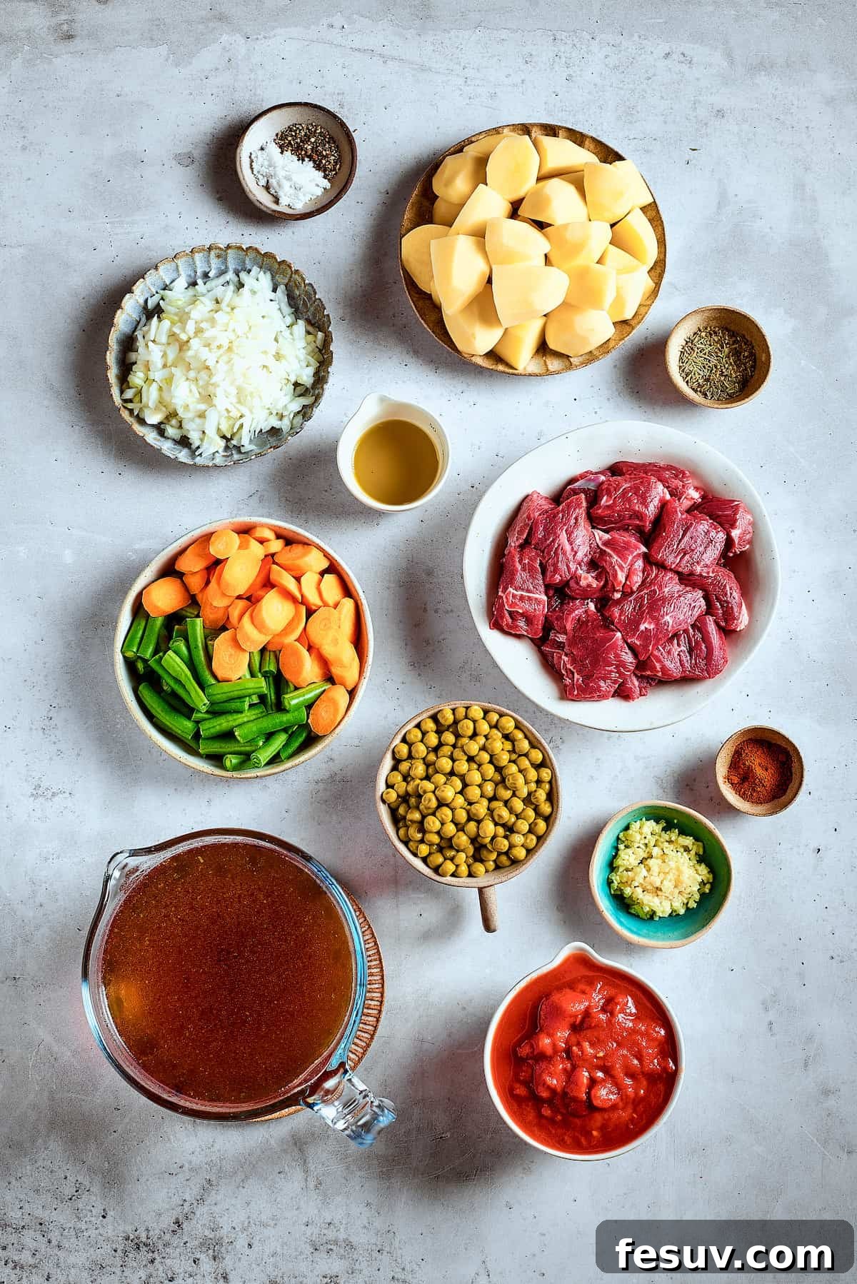As the air gets crisper and the leaves turn golden, it's time to cozy up with a bowl of pure comfort - this old-fashioned Mulligan Stew! Ingredients for Mulligan stew arranged on a table.