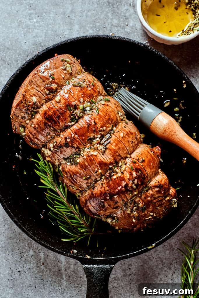Seared Top Round Roast in Skillet A beautifully seared top round roast achieving a deep golden-brown crust in a cast iron skillet, ready to go into the oven.