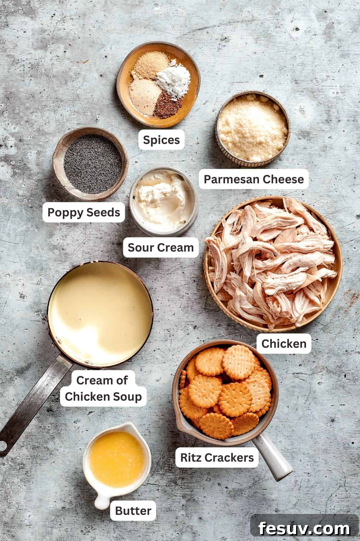 This creamy Poppy Seed Chicken casserole features a rich, poppyseed-flecked sauce that wraps cozily around tender shredded chicken. A vibrant flat lay showcasing all the fresh and pantry ingredients needed for a delicious poppy seed chicken casserole: poppy seeds, parmesan cheese, chicken, sour cream, aromatic spices, cream of chicken soup, Ritz crackers, and melted butter.