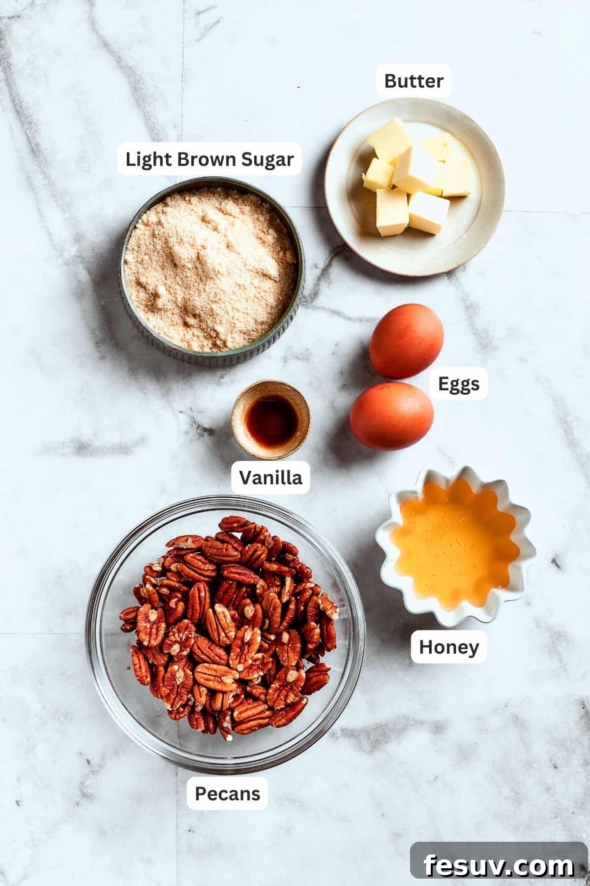 Pecan pie topping ingredients for that irresistible gooey layer. The delectable filling ingredients for pecan pie brownies: pecans, vanilla extract, eggs, honey, and brown sugar.