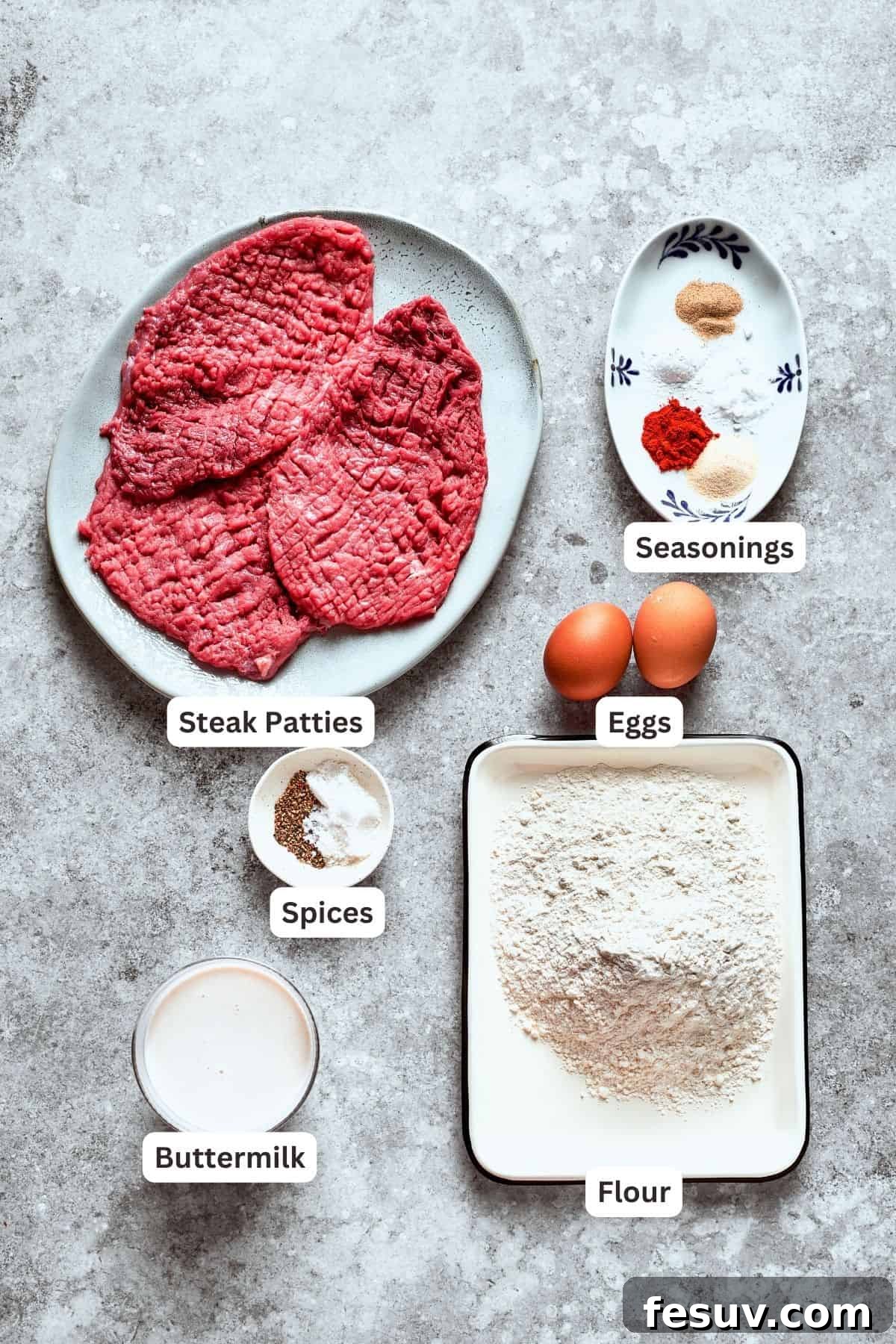 All the components for a perfect chicken fried steak. Ingredients for chicken fried steak, including steak, eggs, flour, and seasonings.