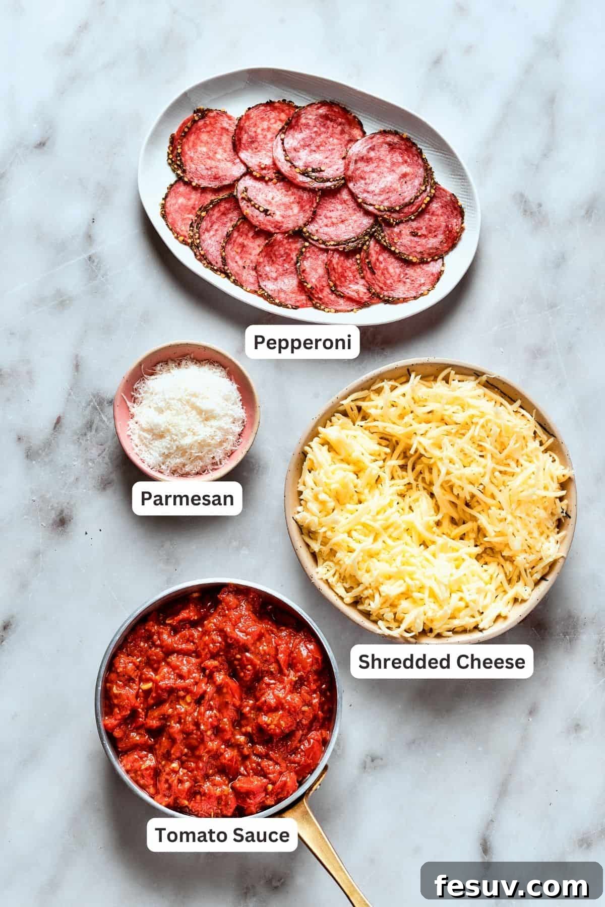 A selection of premium cheeses and pepperoni for the ultimate deep dish experience. Deep dish pizza toppings layout: shredded mozzarella, shredded Edam, grated Parmesan, thick tomato sauce, and sliced pepperoni.