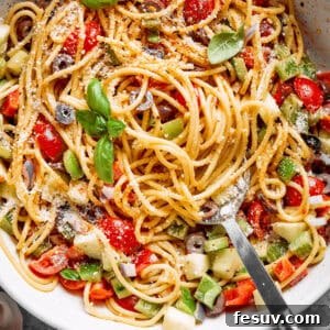 Zesty Spaghetti Salad 2 Fresh vegetables are shown in a bowl of spaghetti salad.