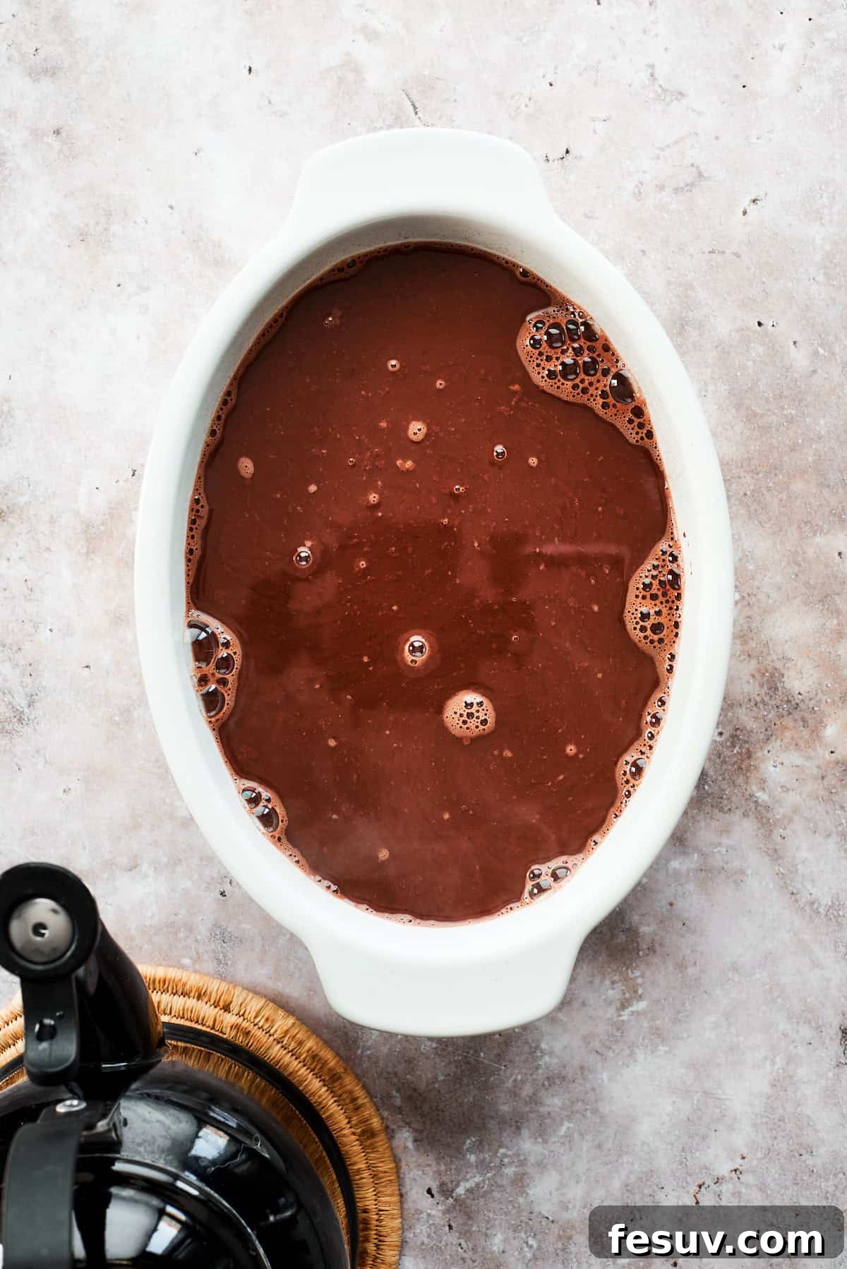 Heavenly Chocolate Pudding Cake 13 Boiling water is poured over the cake and topping in the pan.