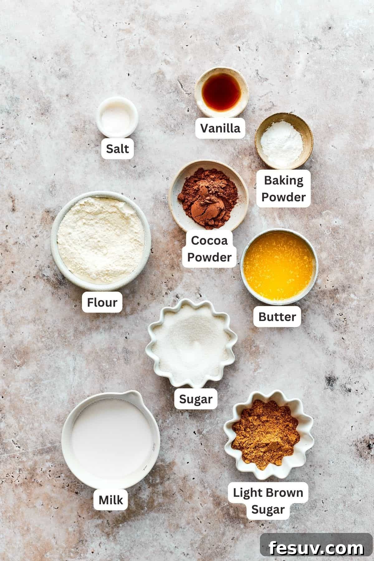 Heavenly Chocolate Pudding Cake 4 Chocolate pudding cake cake batter ingredients are shown labelled: brown sugar, granulated sugar, baking powder, cocoa powder, salt, vanilla, milk, flour.