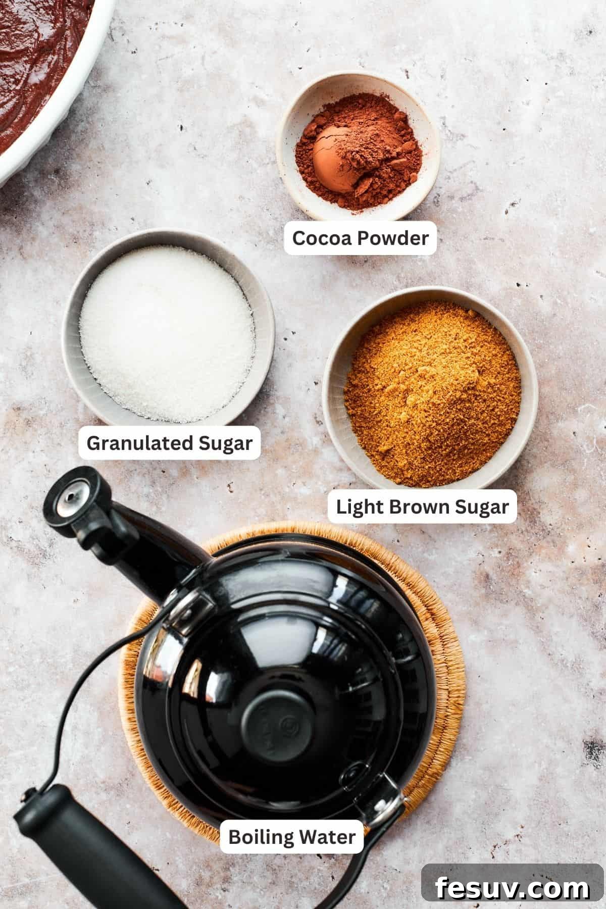 Heavenly Chocolate Pudding Cake 5 Chocolate pudding cake topping ingredients are labeled: boiling water, brown sugar, granulated sugar, cocoa powder.
