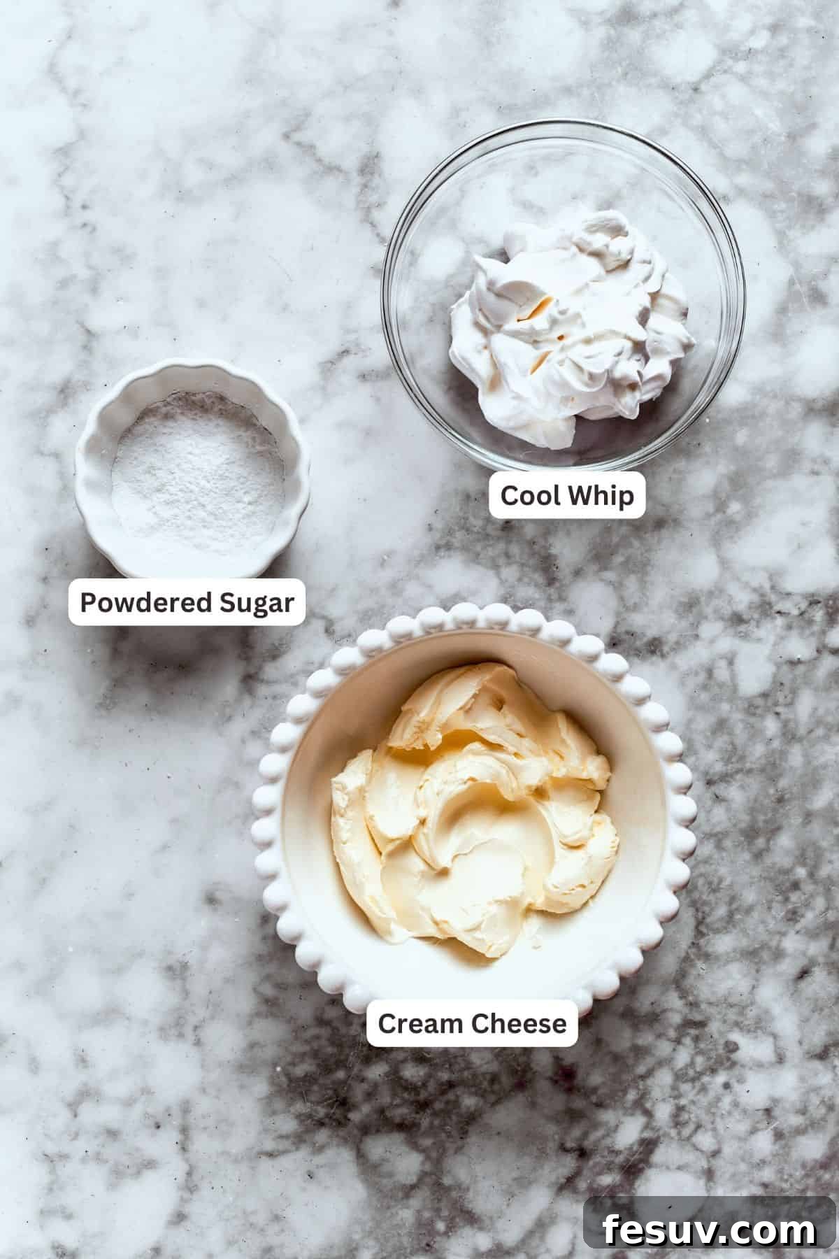 This easy Sex in a Pan recipe layers a tangy-sweet cream cheese filling with vanilla and chocolate puddings on top of a pecan crust. Vanilla pudding mix and milk, ingredients for the vanilla layer.