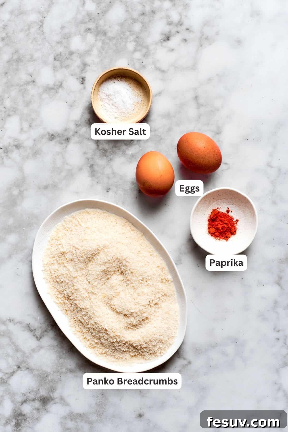 Breading ingredients for chicken nuggets recipe: panko breadcrumbs, salt, eggs, paprika.