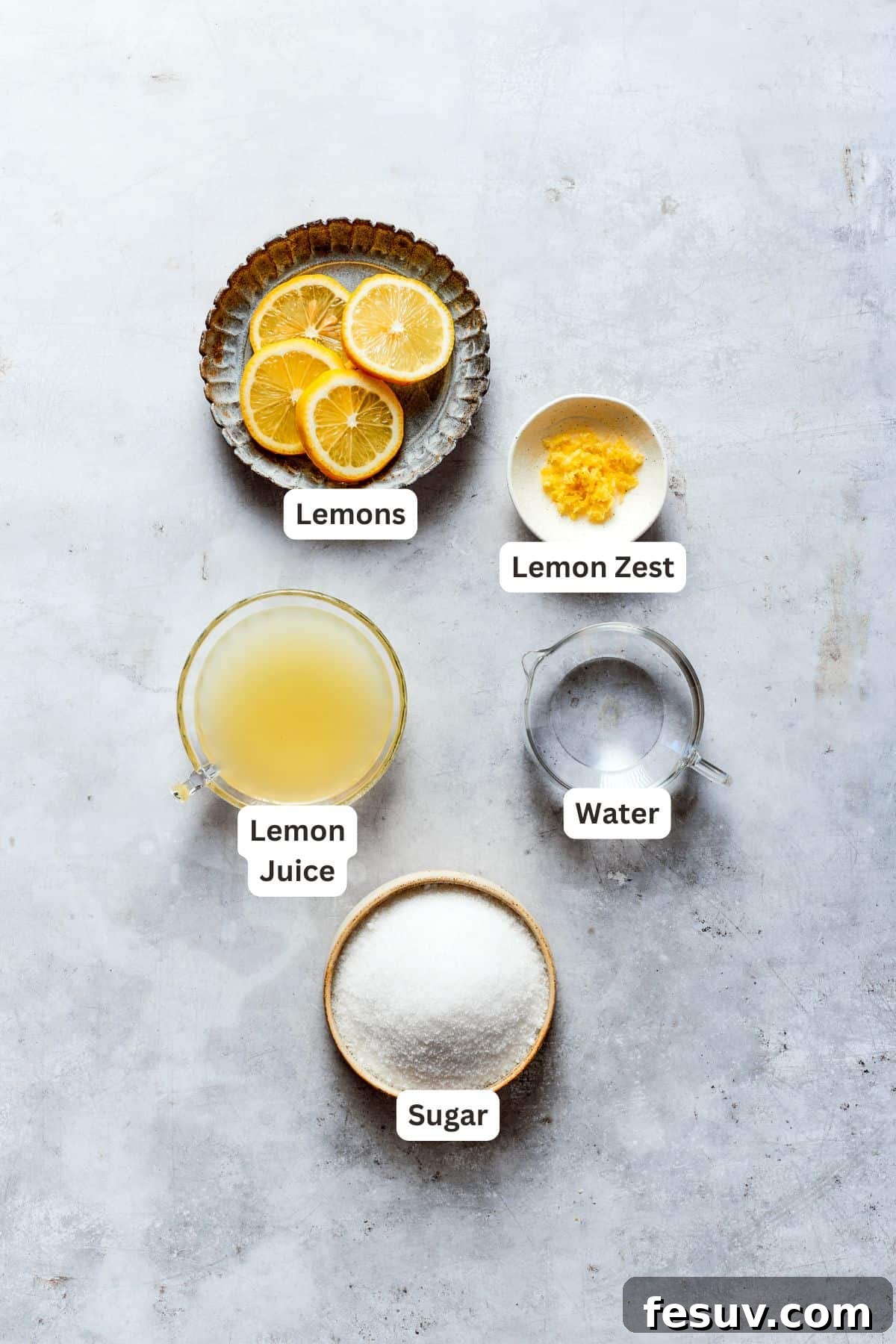 Sun-Kissed Lemon Tiramisu 3 Ingredients for making homemade lemon syrup: fresh lemons, granulated sugar, and water, along with lemon zest.