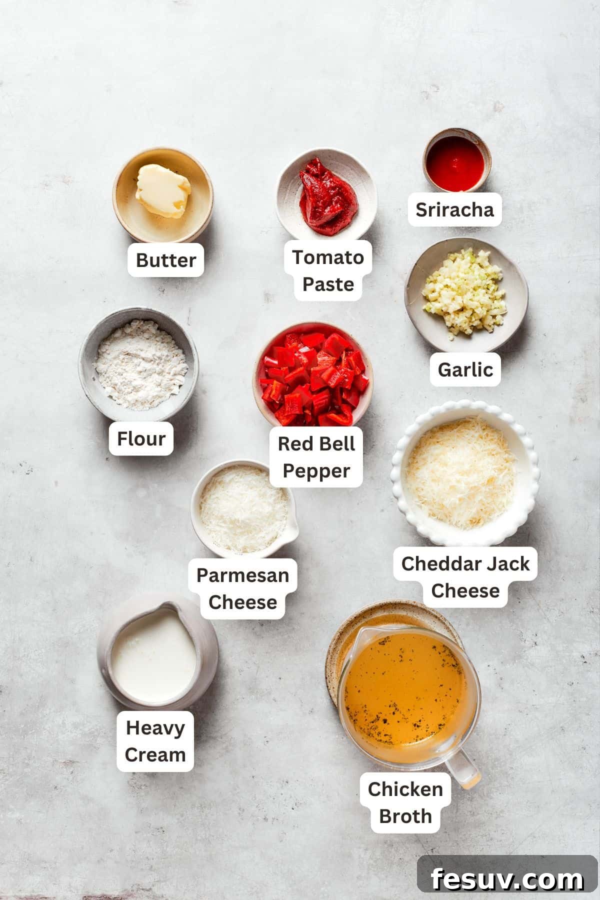 Labeled ingredients for cajun shrimp sauce include butter, tomato pasta, garlic, sriracha, cheddar jack cheese, parmesan cheese, heavy cream, chicken broth.