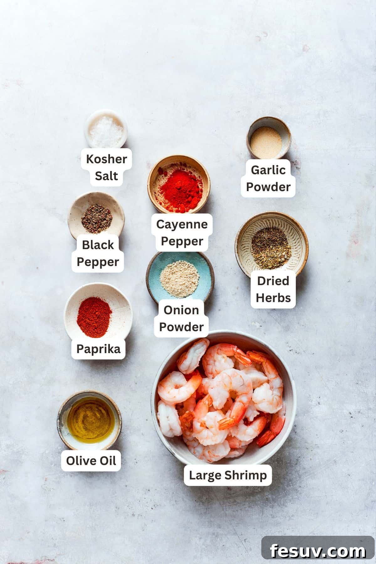 Labeled ingredients for cajun shrimp include black pepper, cayenne pepper, salt, garlic powder, dried herbs, onion powder, paprika, olive oil, shrimp.