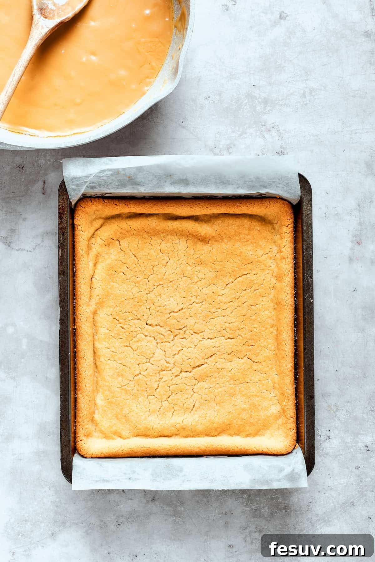 Baked shortbread crust cools in a pan after baking.