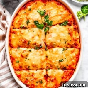 The Gold Standard Spaghetti Bake 2 Overhead image of baked Million Dollar Spaghetti in a casserole dish, showcasing its golden cheese crust and rich texture.