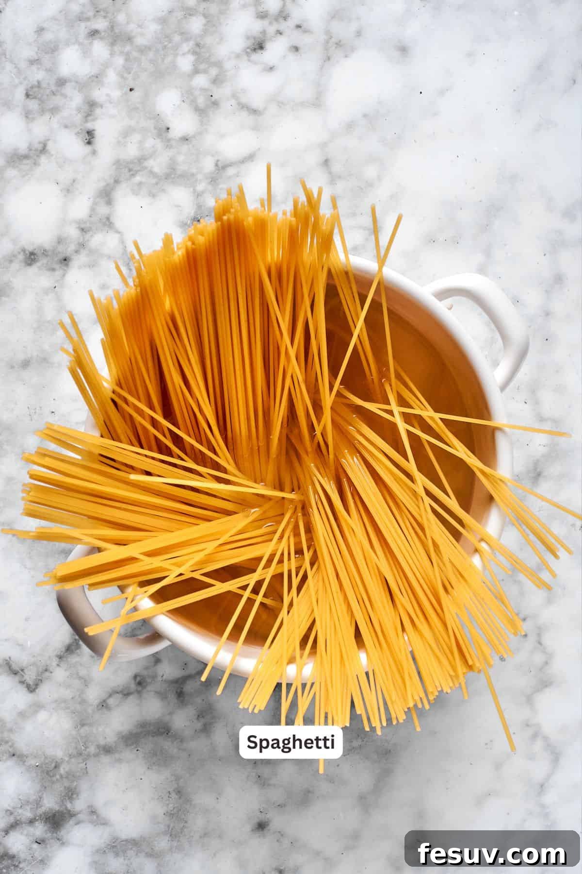Prepping Spaghetti for the Casserole Spaghetti cooking in a large pot, ready for the million dollar spaghetti casserole.