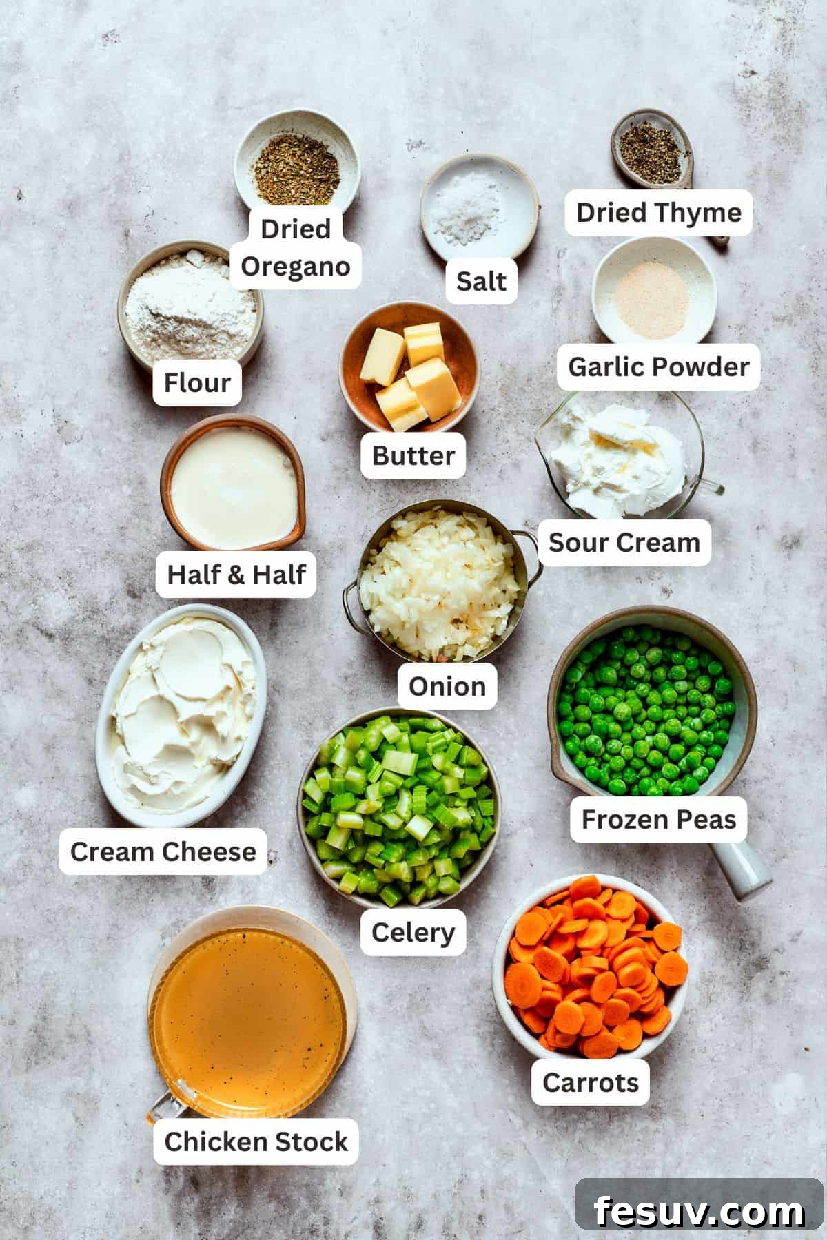 Chicken pot pie casserole is everything you love about the classic comfort food, baked under fluffy buttermilk biscuits instead of pie crust! A collection of fresh ingredients for chicken pot pie filling, including chicken, carrots, celery, onion, and various seasonings.