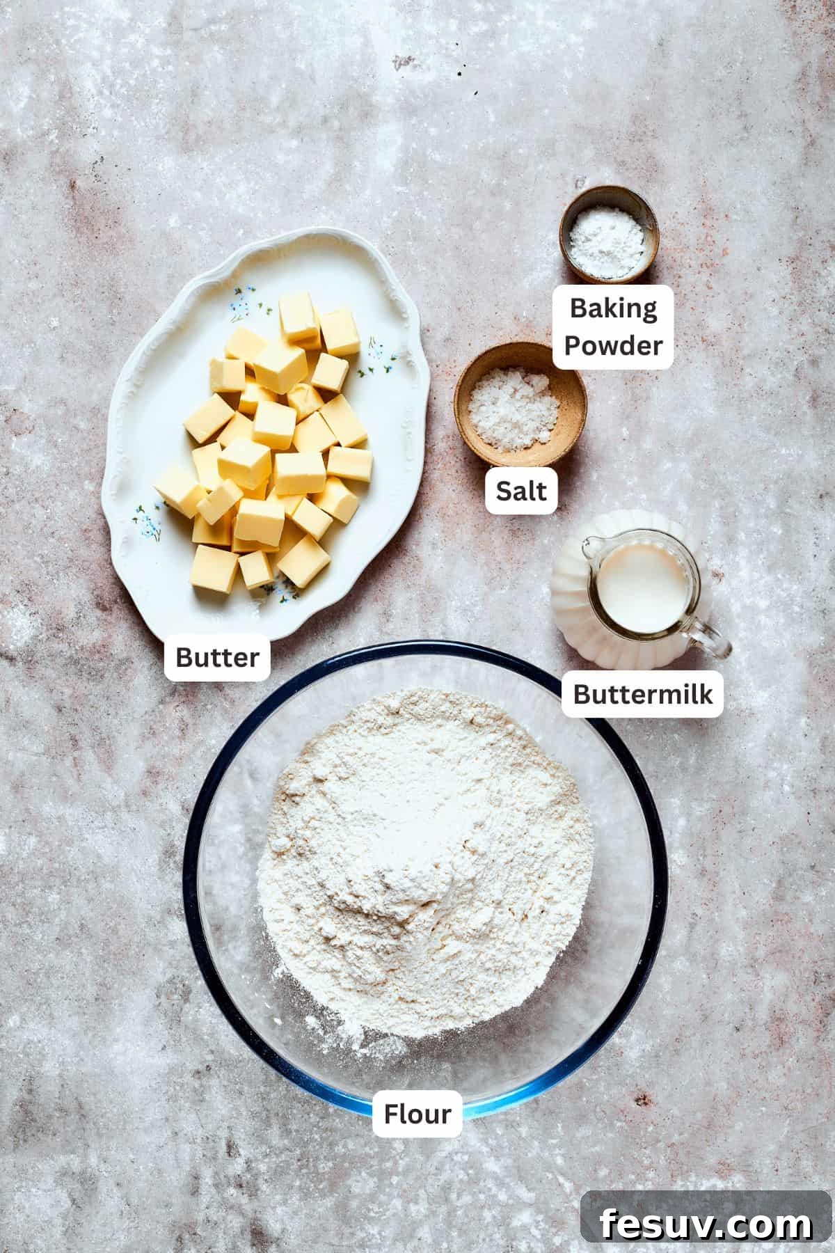 Chicken pot pie casserole is everything you love about the classic comfort food, baked under fluffy buttermilk biscuits instead of pie crust! Ingredients for making homemade buttermilk biscuits, including flour, baking powder, salt, butter, and buttermilk.
