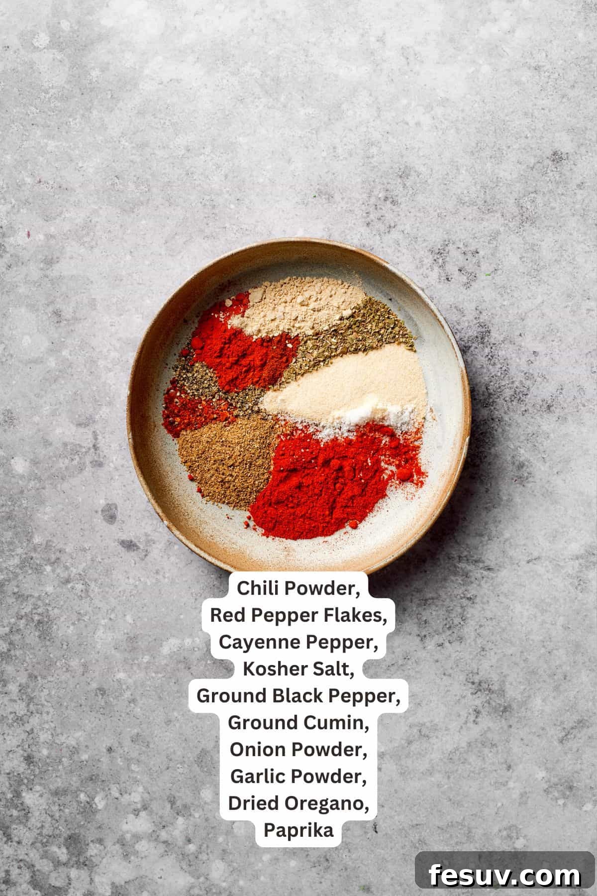 Essential seasoning ingredients for a delicious Mexican spaghetti recipe, including chili powder, cumin, and paprika. Various seasoning ingredients for Mexican taco spaghetti are laid out and text-labeled.