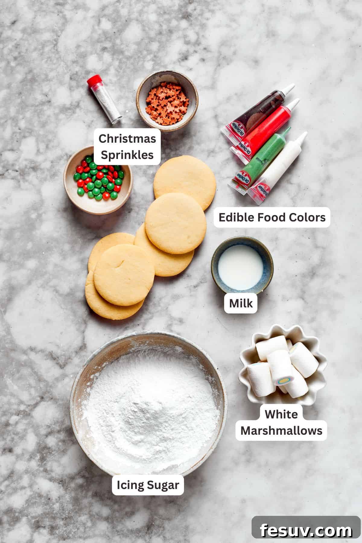 The cutest Melted Snowman Cookies top buttery homemade sugar cookies with a thick vanilla frosting and a fluffy marshmallow! Various ingredients for melted snowman cookies, ready for use.