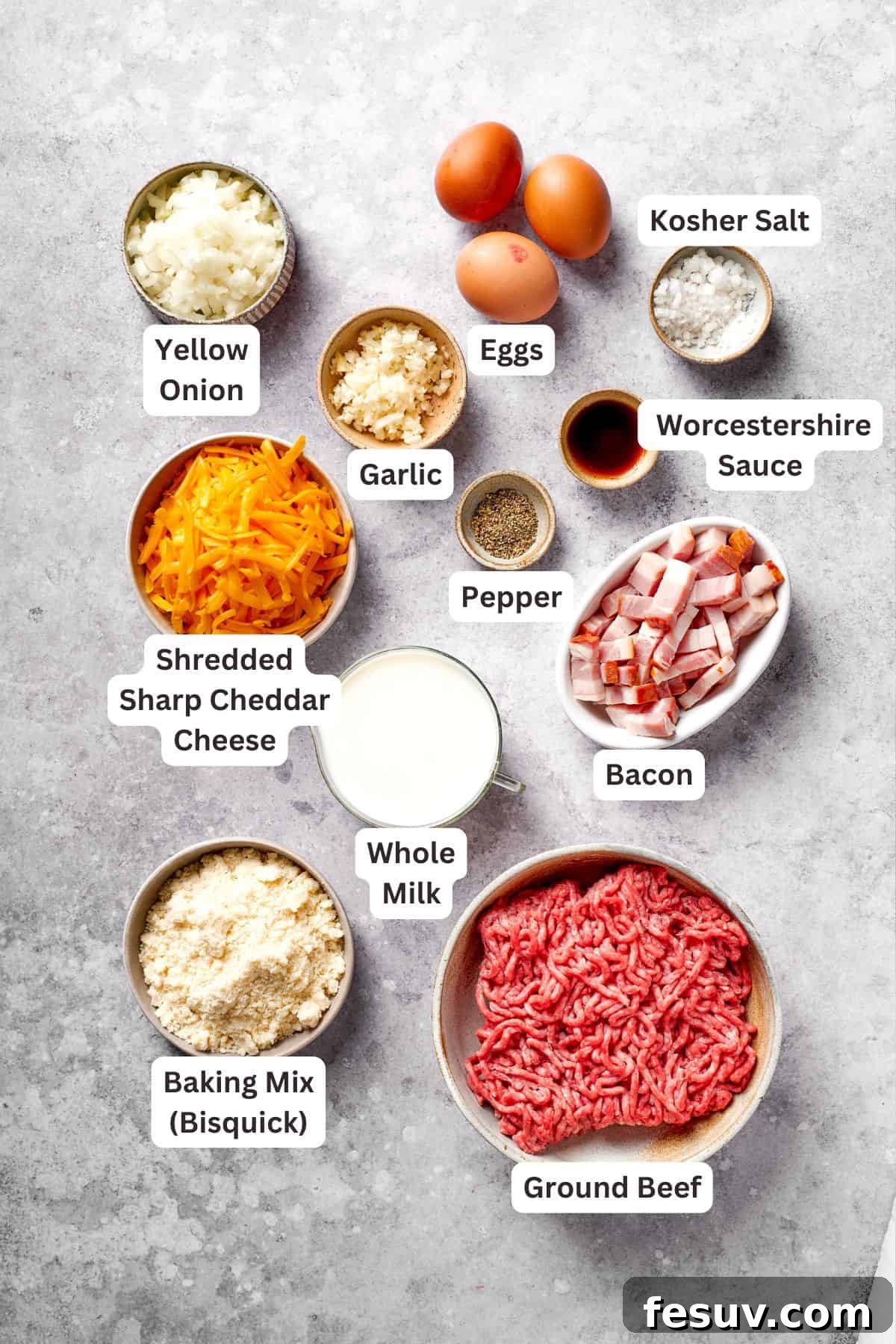 All the essential ingredients for making a delicious cheeseburger pie are neatly arranged and clearly labeled for easy identification.