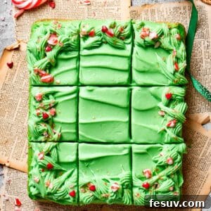 A grinch cake is cut into 12 pieces.