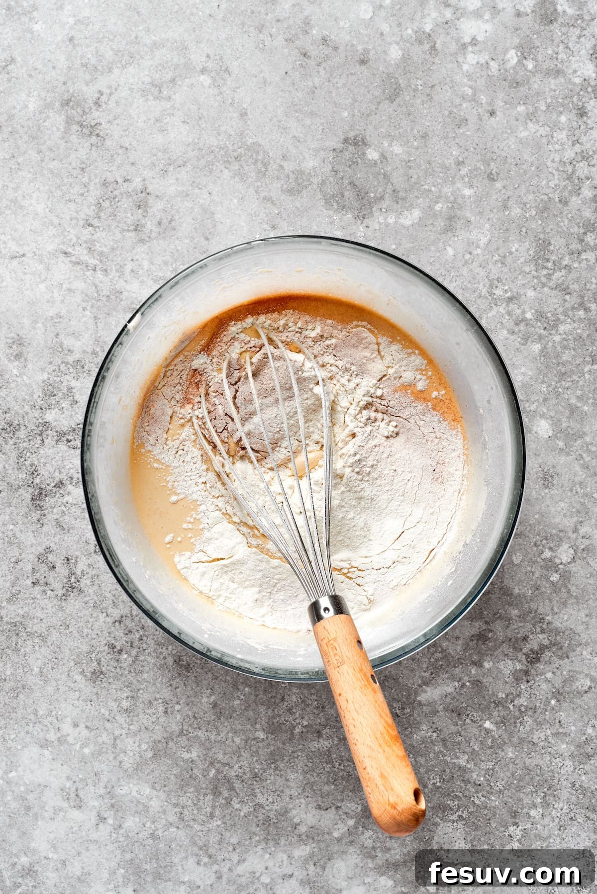 Dry mix is added to carrot cake batter.