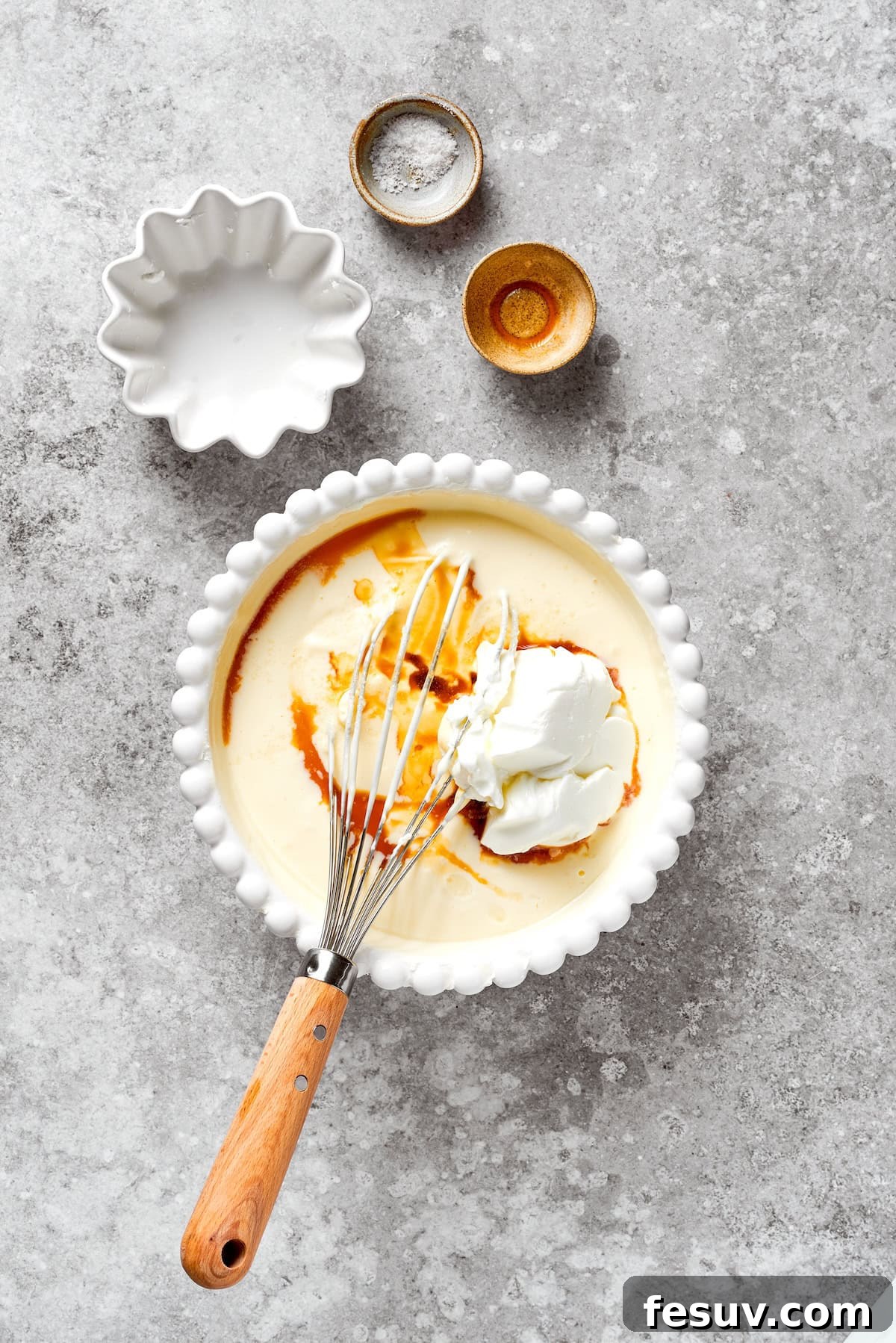 Vanilla is added to cheesecake batter.