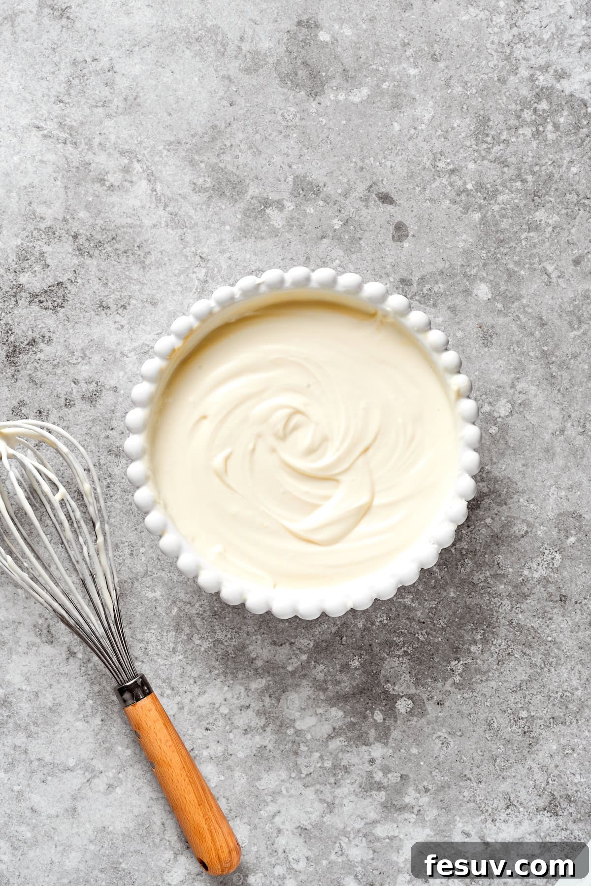 A smooth bowl of cheesecake batter.