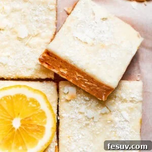 A square of lemon slice on top of other lemon slices.