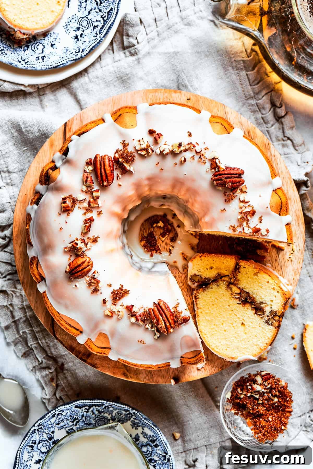 The 'Just One More' Cake 3 An inviting overhead shot of a freshly baked and glazed Sock It To Me Cake, beautifully topped with chopped pecans.