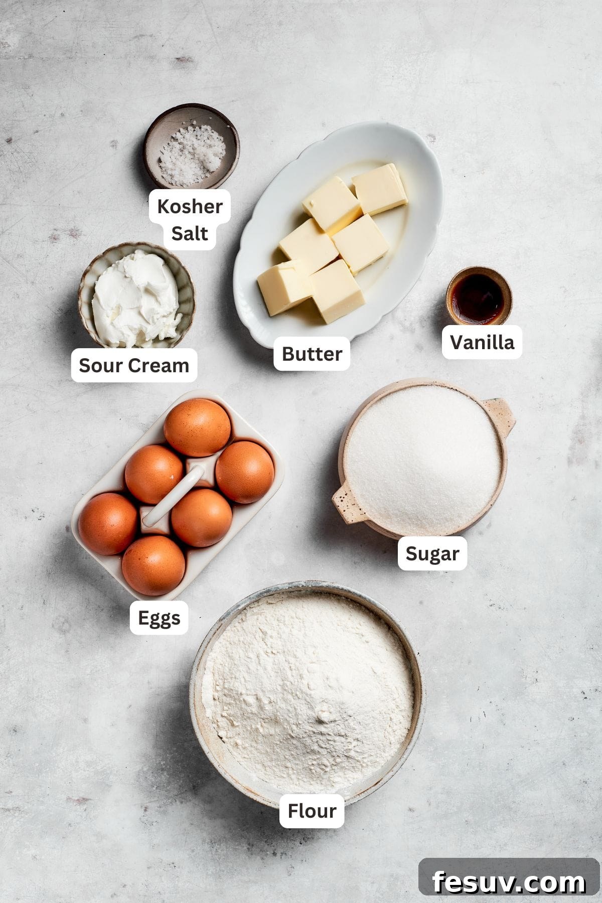 The 'Just One More' Cake 4 A selection of primary ingredients for Sock It To Me Cake, clearly labeled for easy identification, including flour, sugar, butter, and eggs.