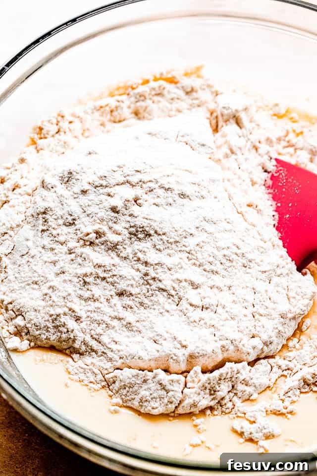 Effortless Sheet Pan Pancakes 3 pancake batter in a glass mixing bowl