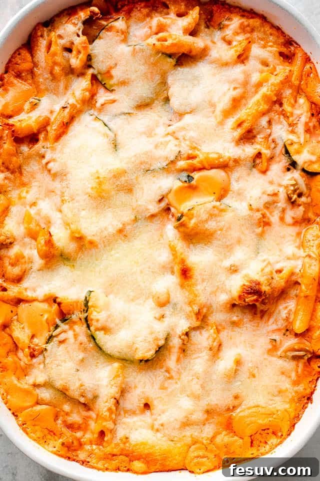 Velvety Zucchini Mushroom Pasta Bake 6 top overhead shot of a cheesy covered baked pasta and zucchini casserole