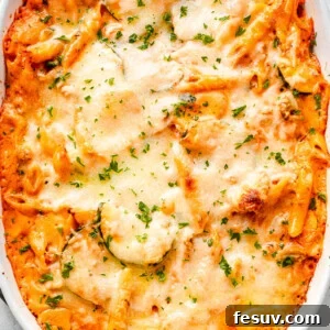 overhead shot of a cheesy baked pasta and zucchini casserole