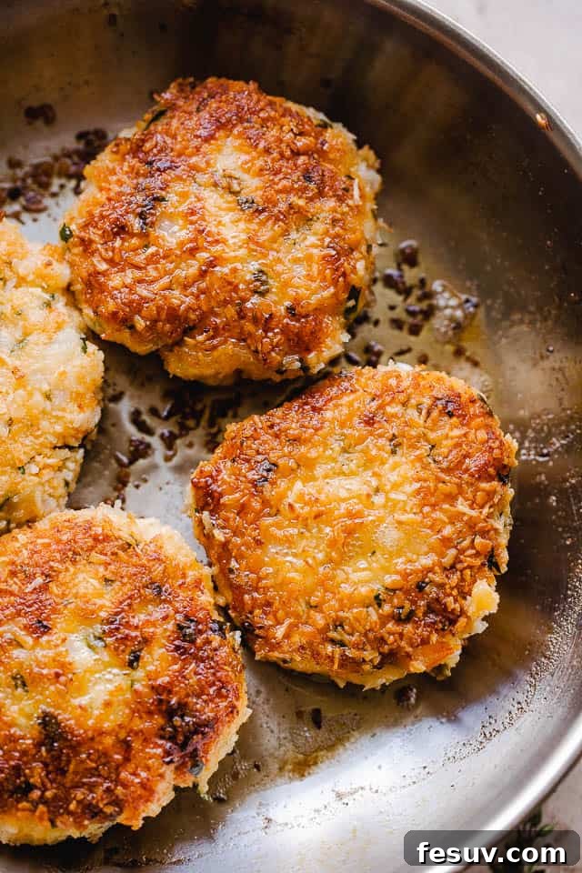cooking shrimp cakes in a skillet