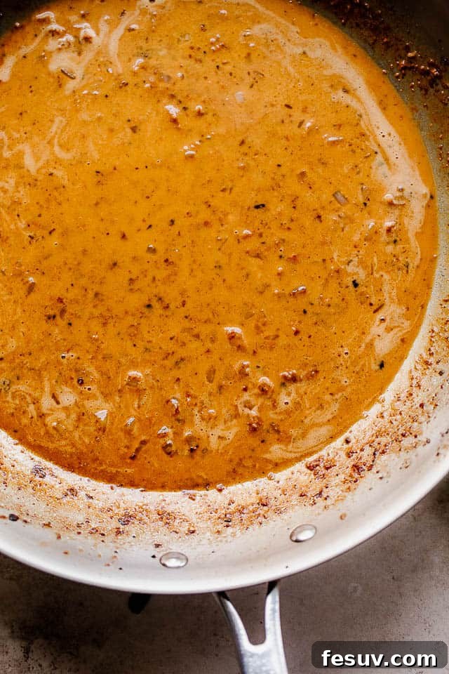 overhead shot of heavy cream sauce in a skillet
