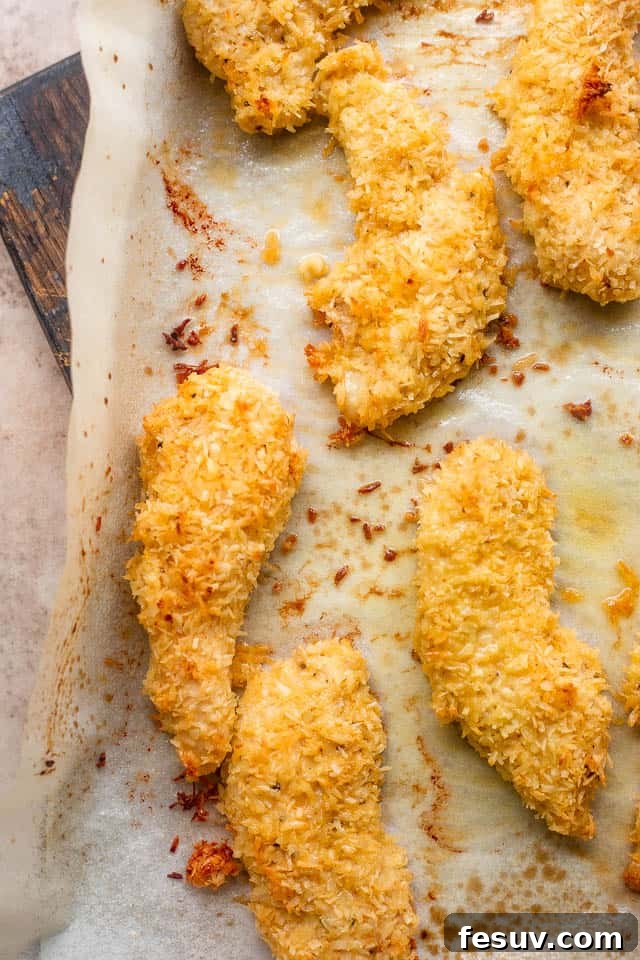 Tropical Coconut Chicken Strips 5 overhead shot of chicken tenders on a baking sheet