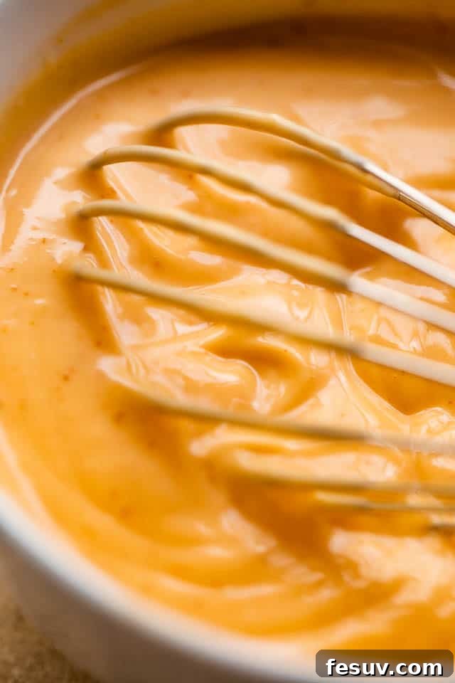 Tropical Coconut Chicken Strips 6 whisking mayo sriracha dipping sauce