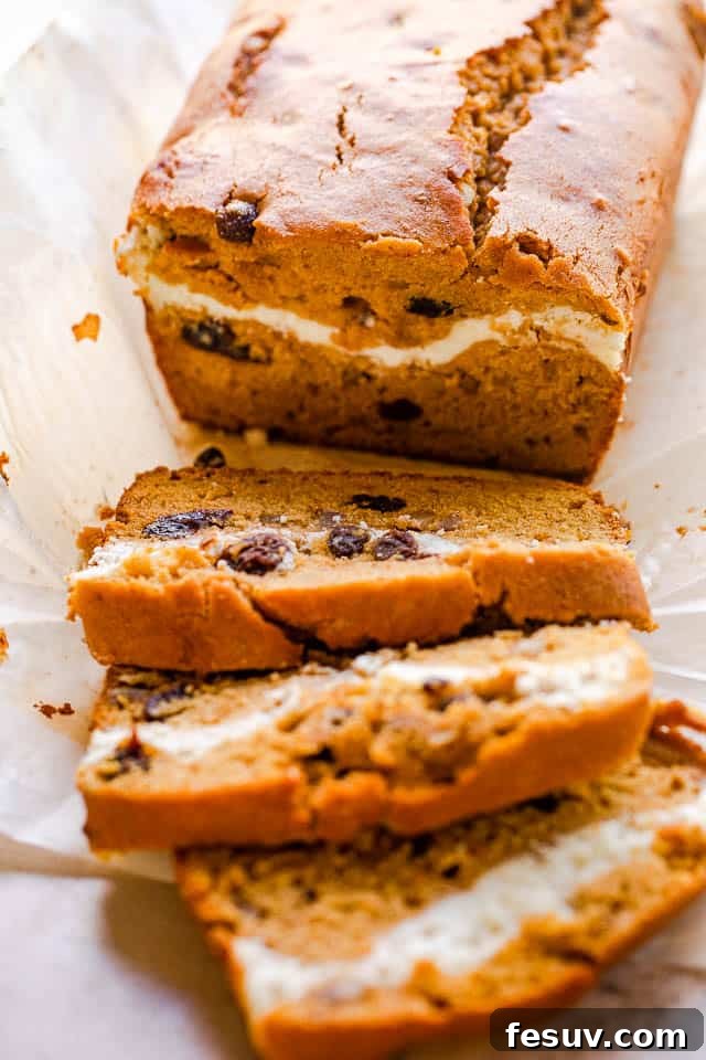 Cinnamon Swirl Pumpkin Bread 2 side shot of pumpkin swirl bread cut in slices