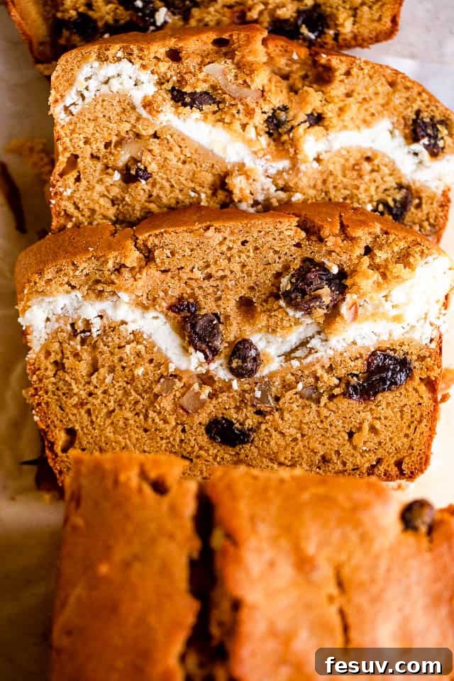 Cinnamon Swirl Pumpkin Bread 6 overhead shot of pumpkin bread with a swirl of cream cheese and raisins