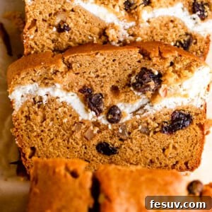 Cinnamon Swirl Pumpkin Bread 7 overhead shot of pumpkin bread with a swirl of cream cheese and raisins