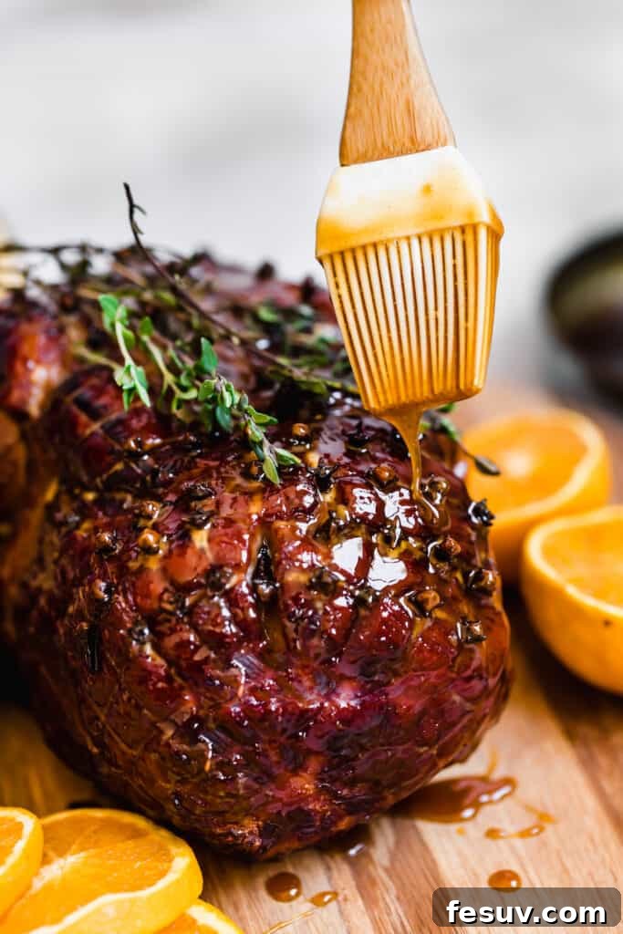 Brown Sugar Glaze Being Poured Over a Fresh-From-the-Oven Ham, creating a luscious, glossy finish.