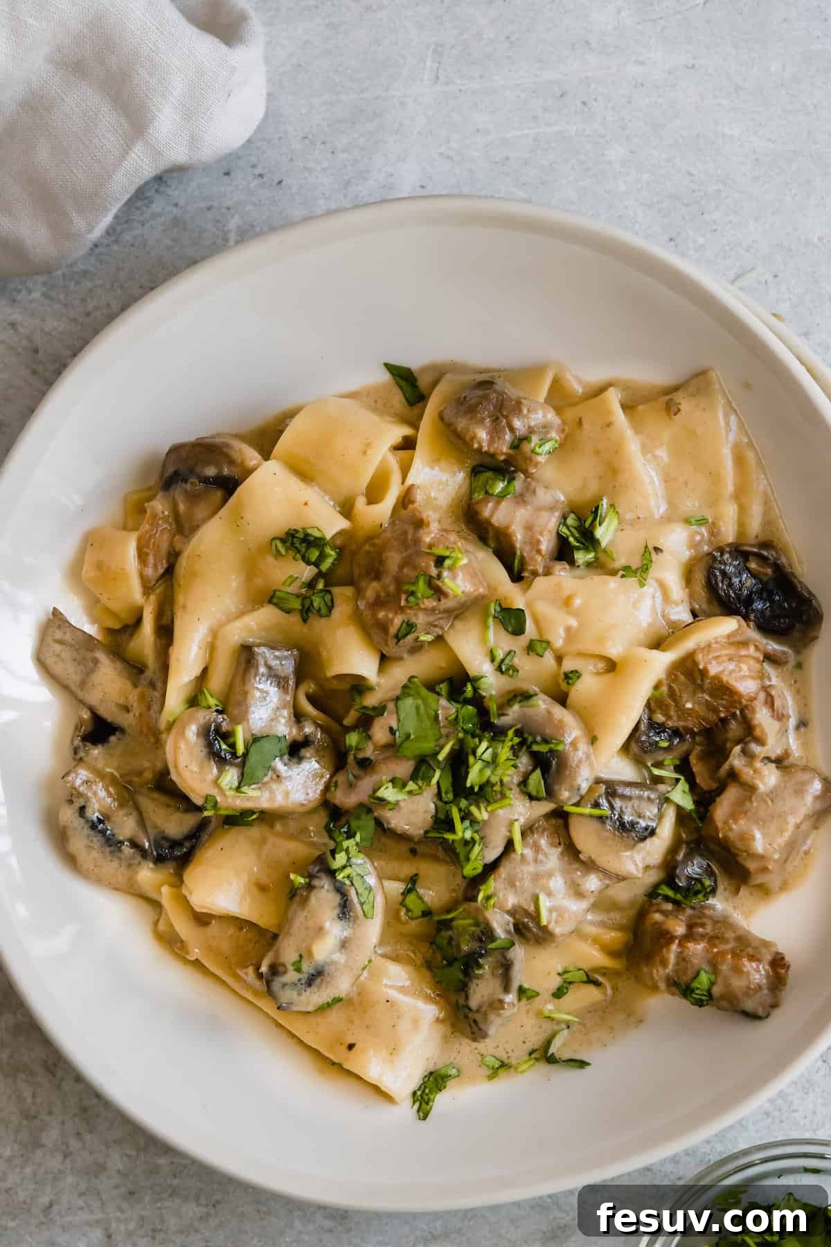 Effortless Creamy Instant Pot Beef Stroganoff 14 A Plate of Beef Stroganoff Garnished with Fresh Parsley, perfectly plated.