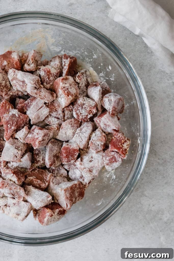 Effortless Creamy Instant Pot Beef Stroganoff 7 Cubes of Beef Coated in the Flour Mixture, evenly seasoned.