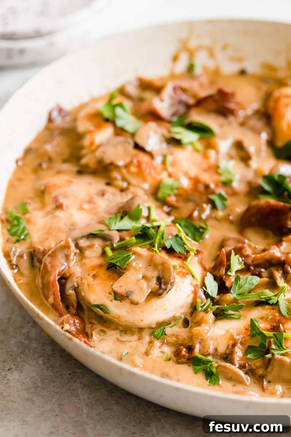 Rich Creamy Chicken Marsala 11 Chicken in a creamy sauce with sliced mushrooms and fresh herbs.