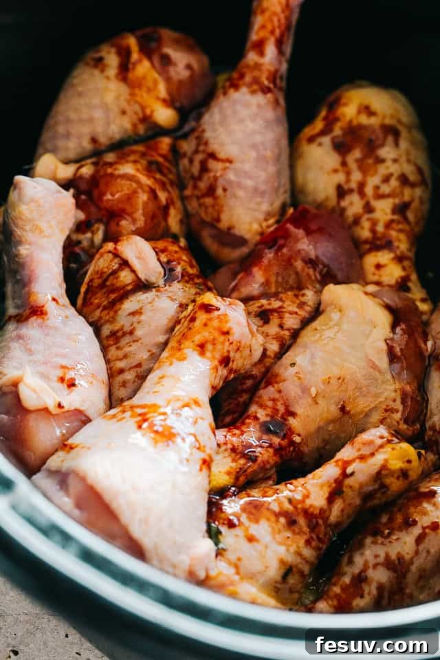 raw chicken legs in a slow cooker