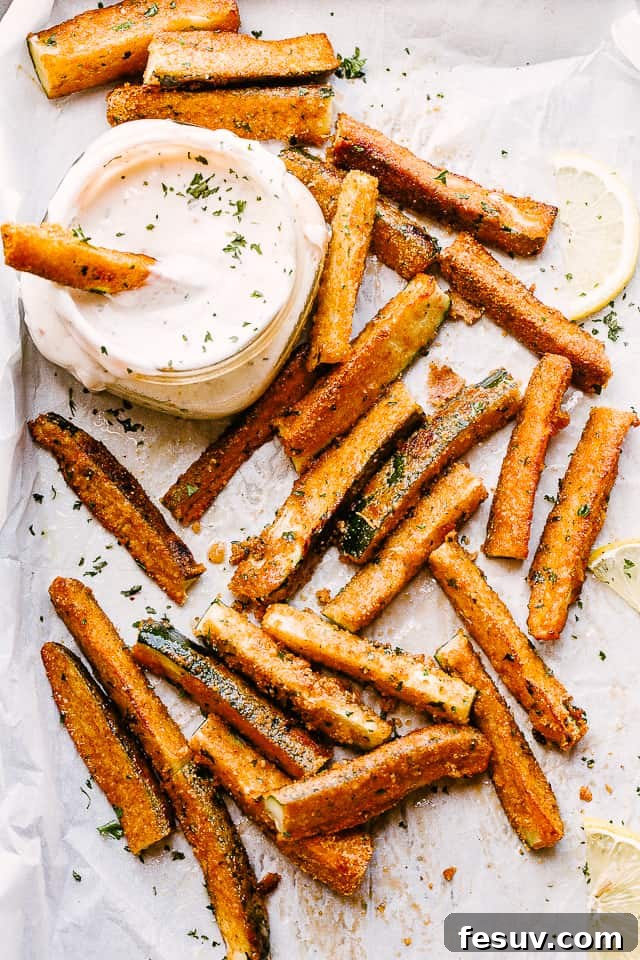 These air fryer zucchini fries are super crispy on the outside, tender on the inside, and perfect for dipping. Your go-to summer side dish! Crispy zucchini fries with dipping sauce