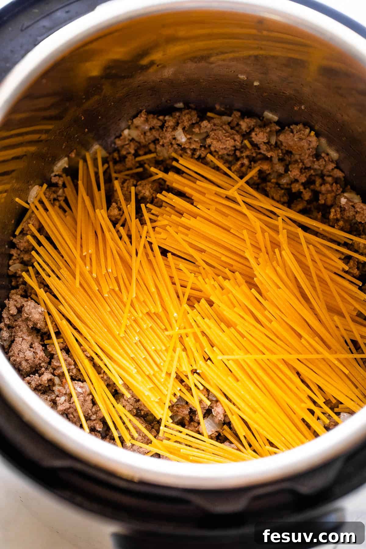 One-Pot Wonder Spaghetti 4 dry spaghetti set over ground beef in the instant pot