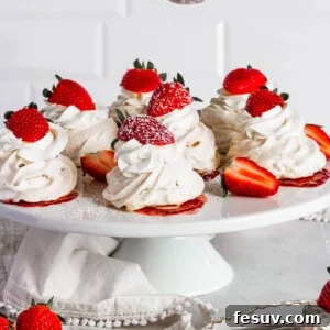 Sifting confectioners sugar onto pavlovas