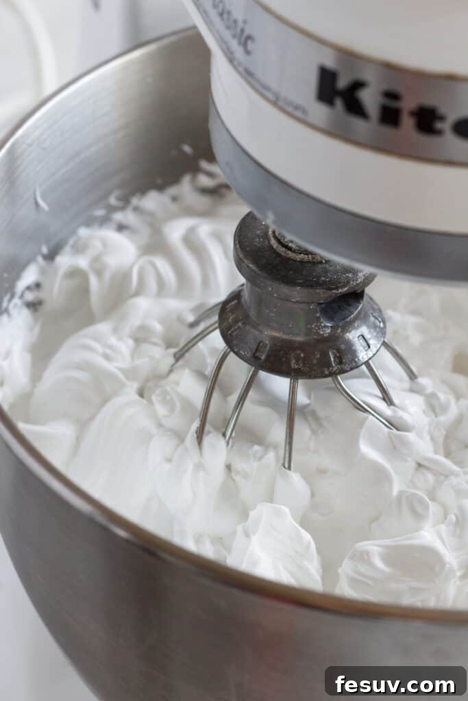 A stand mixer whipping up pavlova