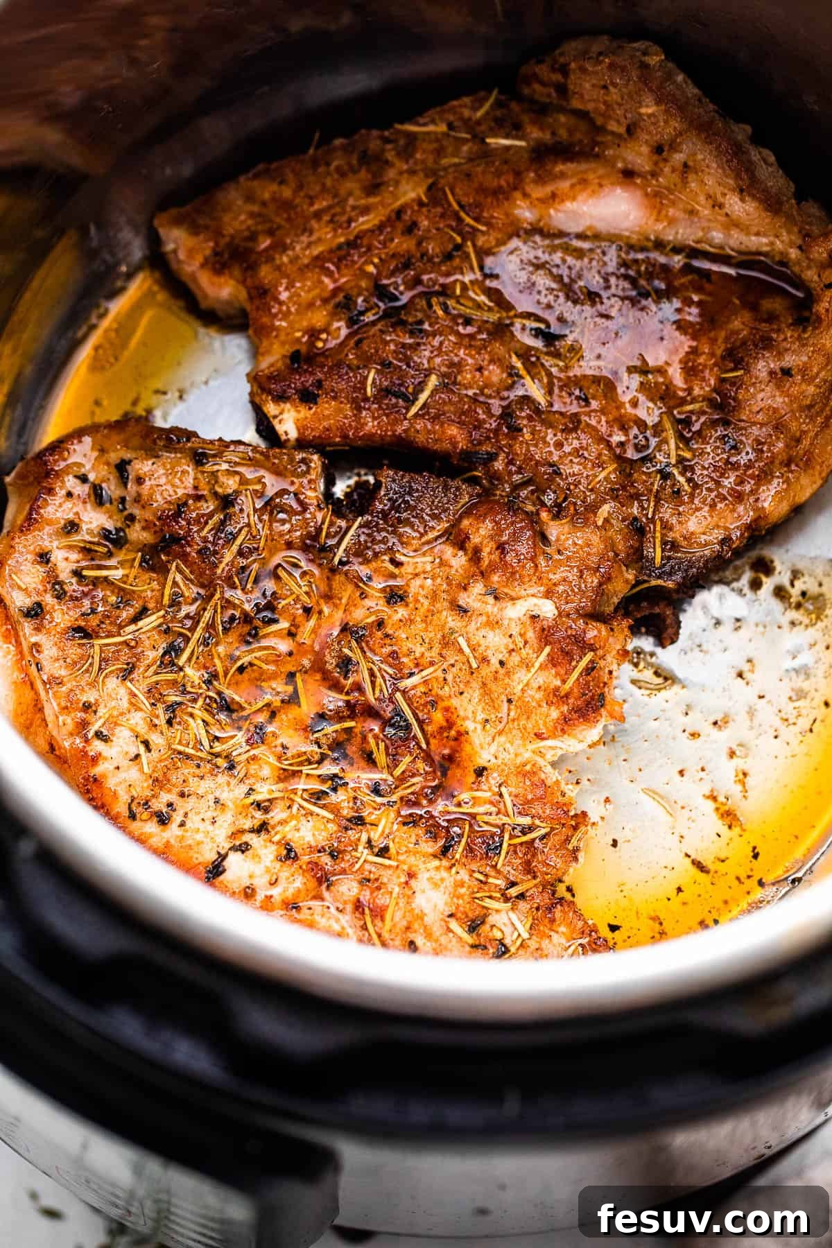 Perfectly Tender Instant Pot Pork Chops 4 Browning two bone-in pork chops to a beautiful golden crust directly inside the Instant Pot's inner pot, a crucial step for flavor development.